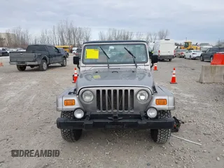 2001 Jeep Wrangler Sport z VIN 1J4FA49S31P349269, wystawiony jako IAAI lot #41427014 z przebiegiem 112 421 mil mil oraz . Historia ofert i sprzedaży dostępna na DreamBid. Obrazek 6.