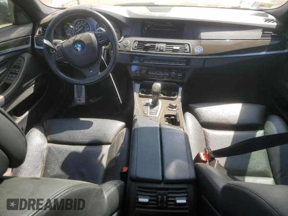 2013 BMW 5 Series 550i xDrive with VIN WBAFU9C52DDY71651, listed as a Copart auction lot 52156465 with 144,211 mi miles and Salvage title. Bid and sale history available at DreamBid. Image 8.