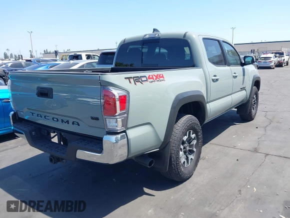 2023 Toyota Tacoma SR with VIN 3TMCZ5AN3PM590101, listed as a IAAI auction lot 42338670 with 12,970 mi miles and . Bid and sale history available at DreamBid. Image 4.