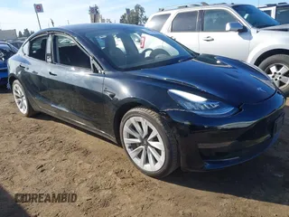 2022 Tesla Model 3 with VIN 5YJ3E1EA9NF295890, listed as a IAAI auction lot 41175917 with 42,230 mi miles and . Bid and sale history available at DreamBid. Image 1.