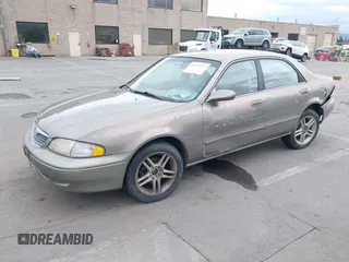 1999 Mazda 626 ES with VIN 1YVGF22C8X5900510, listed as a IAAI auction lot 41479213 with 178,182 mi miles. Bid and sale history available at carsss.com. Image 2.