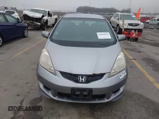2009 Honda Fit Sport with VIN JHMGE88469S063030, listed as a IAAI auction lot 42064670 with 156,791 mi miles. Bid and sale history available at carsss.com. Image 6.