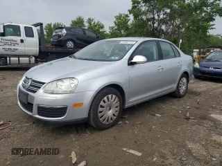 2009 Volkswagen Jetta S z VIN 3VWJM71K59M021158, wystawiony jako Copart lot #57352115 z przebiegiem 168 970 mil mil oraz Czysty tytuł • Clean title. Historia ofert i sprzedaży dostępna na DreamBid. Obrazek 1.