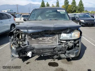 2001 Mazda Tribute LX with VIN 4F2YU09151KM38909, listed as a Copart auction lot 77808264 with 136,005 mi miles and Salvage Title. Bid and sale history available at carsss.com. Image 5.