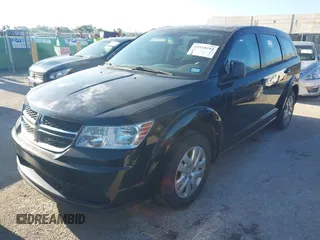 2014 Dodge Journey American Value with VIN 3C4PDCAB8ET310539, listed as a IAAI auction lot 42518244 with 170,906 mi miles and . Bid and sale history available at DreamBid. Image 2.