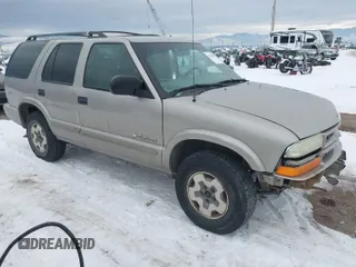 2004 Chevrolet Blazer LS z VIN 1GNDT13X74K145559, wystawiony jako IAAI lot #41458843 z przebiegiem 156 824 mil mil oraz . Historia ofert i sprzedaży dostępna na DreamBid. Obrazek 1.