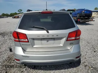 2014 Dodge Journey SXT z VIN 3C4PDCBG7ET126901, wystawiony jako Copart lot #52882625 z przebiegiem 176 923 mil mil oraz Szkoda całkowita • Salvage title. Historia ofert i sprzedaży dostępna na DreamBid. Obrazek 6.