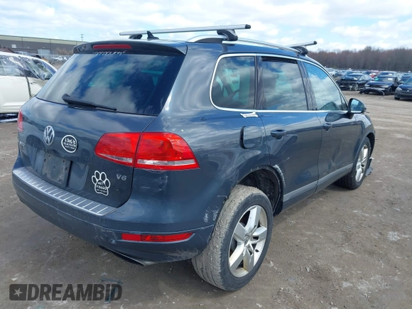 2013 Volkswagen Touareg Lux with VIN WVGEF9BP4DD006851, listed as a IAAI auction lot 41983791 with 115,551 mi miles and . Bid and sale history available at DreamBid. Image 4.