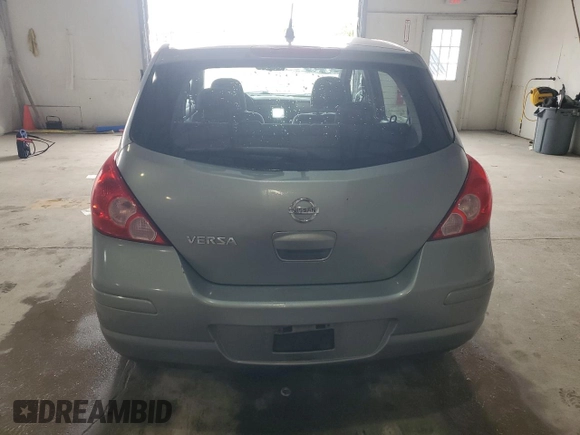 2009 Nissan Versa S with VIN 3N1BC13E59L499698, listed as a Copart auction lot 58242235 with 169,239 mi miles and Clean title. Bid and sale history available at DreamBid. Image 6.