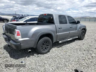 2006 Mitsubishi Raider Duro Cross z VIN 1Z7HC38N86S542959, wystawiony jako Copart lot #57301385 z przebiegiem 149 167 mil mil oraz Tytuł czysty. Historia ofert i sprzedaży dostępna na DreamBid. Obrazek 3.