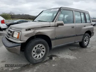 1997 Suzuki Sidekick JX z VIN 2S3TD03V4V6403519, wystawiony jako Copart lot #49666085 z przebiegiem 54 577 mil mil oraz Szkoda całkowita • Salvage title. Historia ofert i sprzedaży dostępna na DreamBid. Obrazek 1.