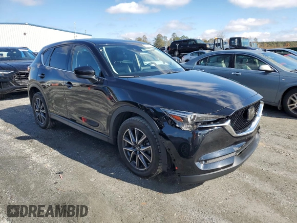 2018 Mazda CX-5 Grand Touring with VIN JM3KFADM5J0325794, listed as a Copart auction lot 79748544 with 106,781 mi miles and Salvage Title. Bid and sale history available at carsss.com. Image 4.