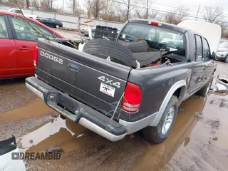 2002 Dodge Dakota SLT z VIN 1B7HG48N32S634478, wystawiony jako IAAI lot #41485500 z przebiegiem 166 082 mil mil oraz . Historia ofert i sprzedaży dostępna na DreamBid. Obrazek 4.