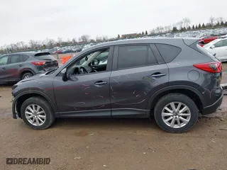 2016 Mazda CX-5 Touring with VIN JM3KE4CY7G0715507, listed as a IAAI auction lot 41699610 with 108,206 mi miles. Bid and sale history available at carsss.com. Image 15.