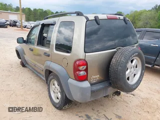 2005 Jeep Liberty Sport with VIN 1J4GL48K65W531365, listed as a IAAI auction lot 42004136 with 160,756 mi miles. Bid and sale history available at carsss.com. Image 3.
