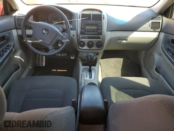 2005 Kia Spectra with VIN KNAFE162455069422, listed as a Copart auction lot 52999455 with 249,774 mi miles and Salvage Title. Bid and sale history available at carsss.com. Image 8.