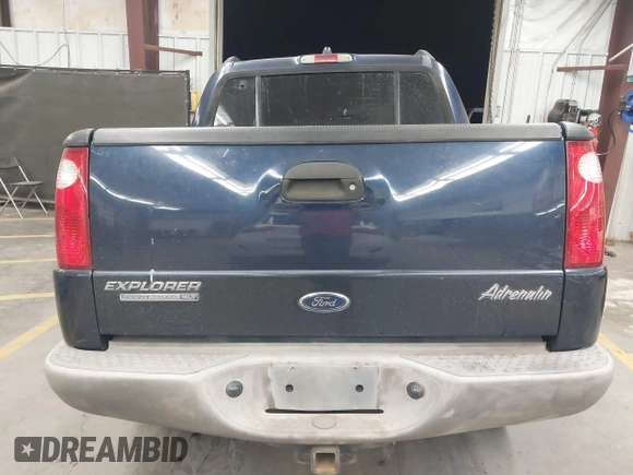 2003 Ford Explorer Sport Trac XLS z VIN 1FMDU77E03UC07089, wystawiony jako IAAI lot #41938966 z przebiegiem 128 982 mil mil oraz . Historia ofert i sprzedaży dostępna na DreamBid. Obrazek 16.