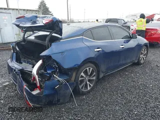 2016 Nissan Maxima SL with VIN 1N4AA6APXGC396890, listed as a IAAI auction lot 41594044 with 144,164 mi miles and . Bid and sale history available at DreamBid. Image 4.