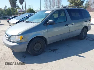 1999 Toyota Sienna LE with VIN 4T3ZF13C1XU097653, listed as a IAAI auction lot 41765274 with 236,625 mi miles. Bid and sale history available at carsss.com. Image 2.