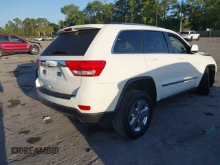 2011 Jeep Grand Cherokee Laredo with VIN 1J4RS4GGXBC739433, listed as a IAAI auction lot 41794031 with 174,672 mi miles and . Bid and sale history available at DreamBid. Image 4.