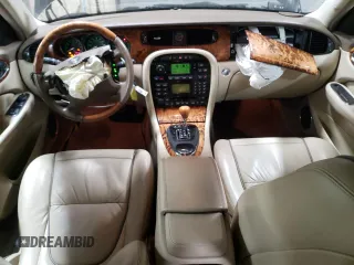2005 Jaguar XJ Vanden Plas z VIN SAJWA82C65SG44373, wystawiony jako Copart lot #84091444 z przebiegiem 141 993 mil mil oraz Szkoda całkowita • Salvage title. Historia ofert i sprzedaży dostępna na DreamBid. Obrazek 8.