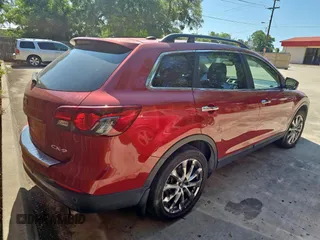 2014 Mazda CX-9 Grand Touring with VIN JM3TB2DA7E0441838, listed as a Copart auction lot 66305865 with 125,585 mi miles and Clean title. Bid and sale history available at DreamBid. Image 4.