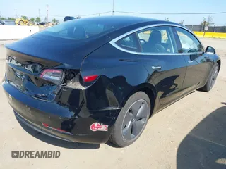 2018 Tesla Model 3 Long Range Battery with VIN 5YJ3E1EA7JF057031, listed as a IAAI auction lot 42139832 with 92,618 mi miles and . Bid and sale history available at DreamBid. Image 4.