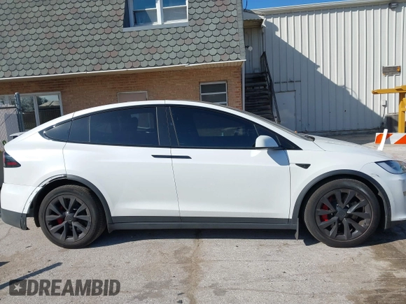2023 Tesla Model X Plaid with VIN 7SAXCBE63PF405105, listed as a IAAI auction lot 41876918 with 22,475 mi miles and . Bid and sale history available at DreamBid. Image 14.