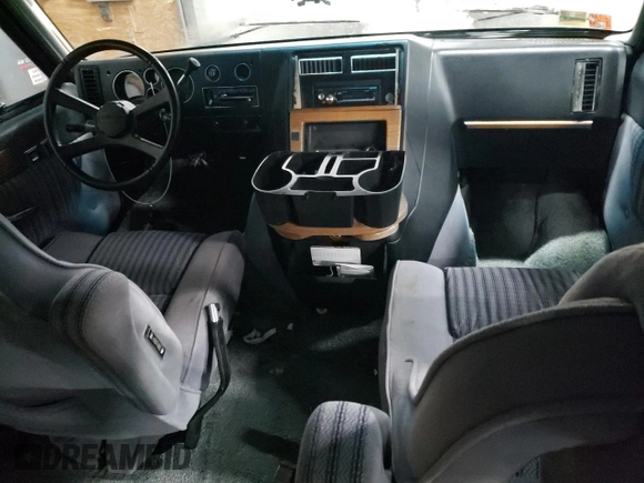 1988 Chevrolet Chevy Van z VIN 2GBEG25K2J4137750, wystawiony jako Copart lot #89310475 z przebiegiem 26 823 mil mil oraz Szkoda całkowita • Salvage title. Historia ofert i sprzedaży dostępna na DreamBid. Obrazek 8.