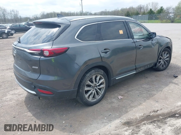 2016 Mazda CX-9 Grand Touring with VIN JM3TCBDY3G0117802, listed as a IAAI auction lot 42150821 with 157,760 mi miles and . Bid and sale history available at DreamBid. Image 4.