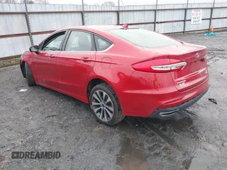 2020 Ford Fusion SE z VIN 3FA6P0T97LR234873, wystawiony jako IAAI lot #41510333 z przebiegiem 65 243 mil mil oraz . Historia ofert i sprzedaży dostępna na DreamBid. Obrazek 3.