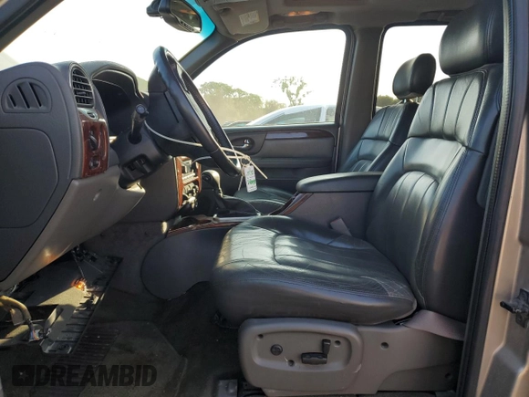 2002 GMC Envoy SLT with VIN 1GKDT13S322420861, listed as a Copart auction lot 63408164 with 250,167 mi miles and Salvage Title. Bid and sale history available at DreamBid. Image 7.