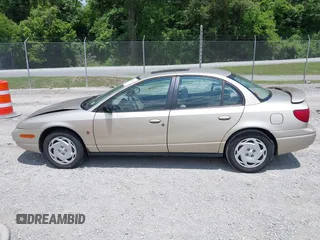 2001 Saturn SL z VIN 1G8ZK54721Z272773, wystawiony jako IAAI lot #42449133 z przebiegiem 56 714 mil mil oraz . Historia ofert i sprzedaży dostępna na DreamBid. Obrazek 14.