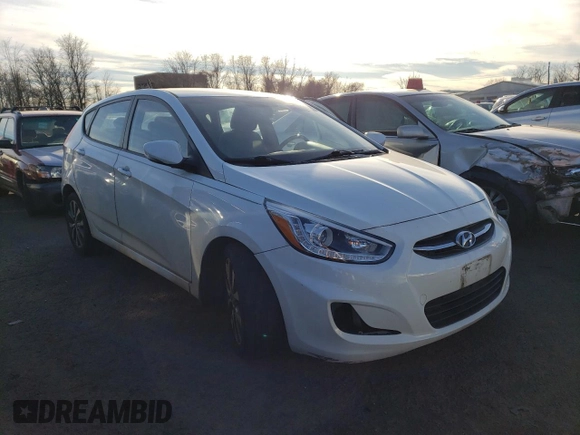 2015 Hyundai Accent Sport with VIN KMHCU5AE2FU217782, listed as a Copart auction lot 41446935 with 99,764 mi miles and Clean Title. Bid and sale history available at carsss.com. Image 4.