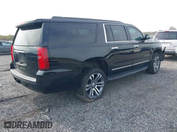 2019 Chevrolet Suburban LT with VIN 1GNSCHKC2KR408575, listed as a IAAI auction lot 42060103 with 144,838 mi miles and . Bid and sale history available at DreamBid. Image 4.