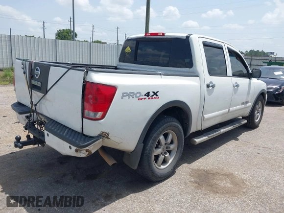 2012 Nissan Titan SL with VIN 1N6BA0EC1CN326919, listed as a IAAI auction lot 42630368 with 230,215 mi miles and . Bid and sale history available at DreamBid. Image 4.