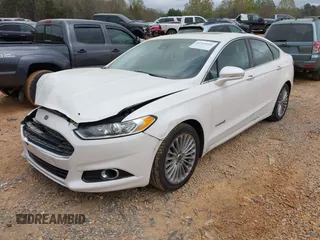 2013 Ford Fusion Titanium Hybrid with VIN 3FA6P0RU2DR308696, listed as a IAAI auction lot 41914944 with 133,710 mi miles. Bid and sale history available at carsss.com. Image 2.