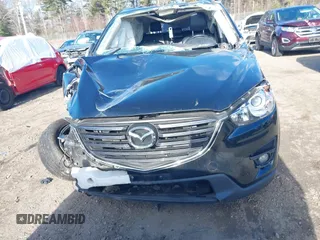 2016 Mazda CX-5 Grand Touring with VIN JM3KE4DY4G0909782, listed as a IAAI auction lot 41006111 with 30,135 mi miles. Bid and sale history available at carsss.com. Image 11.