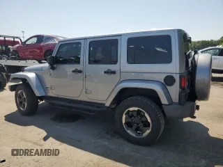 2014 Jeep Wrangler Unlimited Sahara with VIN 1C4BJWEG8EL236951, listed as a Copart auction lot 61046575 with 146,642 mi miles and Salvage title. Bid and sale history available at DreamBid. Image 2.