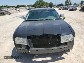 2009 Chrysler 300 with VIN 2C3KA63T39H580730, listed as a Copart auction lot 64933564 with 155,403 mi miles and Salvage Title. Bid and sale history available at carsss.com. Image 5.