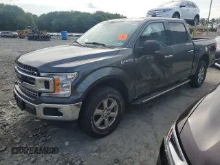 2018 Ford F-150 XL with VIN 1FTEW1EP3JFB55785, listed as a Copart auction lot 61560605 with 70,233 mi miles and Salvage title. Bid and sale history available at DreamBid. Image 1.