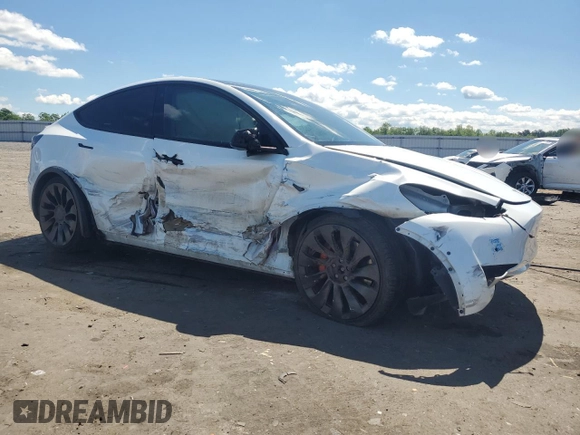 2022 Tesla Model Y Performance with VIN 7SAYGDEF9NF372337, listed as a Copart auction lot 55889345 with 51,099 mi miles and Salvage title. Bid and sale history available at DreamBid. Image 4.