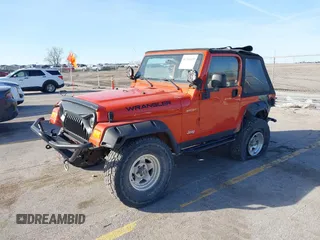 2005 Jeep Wrangler Sport with VIN 1J4FA49S85P344204, listed as a IAAI auction lot 41769319 with 105,927 mi miles. Bid and sale history available at carsss.com. Image 2.