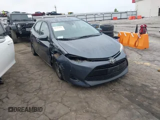 2018 Toyota Corolla L z VIN 5YFBURHE2JP809735, wystawiony jako IAAI lot #42211619 z przebiegiem 121 007 mil mil oraz . Historia ofert i sprzedaży dostępna na DreamBid. Obrazek 1.