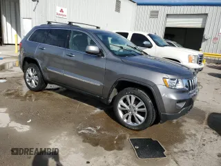 2012 Jeep Grand Cherokee Laredo with VIN 1C4RJEAG1CC306950, listed as a Copart auction lot 84912434 with 128,659 mi miles and Salvage Title. Bid and sale history available at carsss.com. Image 4.