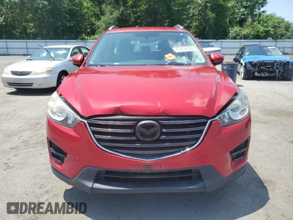 2016 Mazda CX-5 Sport with VIN JM3KE4BY3G0765905, listed as a Copart auction lot 61874165 with 134,546 mi miles and Salvage title. Bid and sale history available at DreamBid. Image 5.