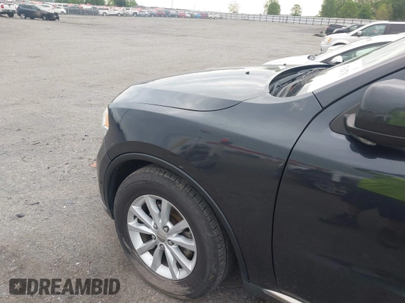 2014 Dodge Durango SXT with VIN 1C4RDJAG7EC307118, listed as a IAAI auction lot 42168781 with 92,977 mi miles and . Bid and sale history available at DreamBid. Image 6.