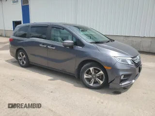 2018 Honda Odyssey with VIN 5FNRL6H49JB504977, listed as a Copart auction lot 60905615 with 180,464 mi miles and Clean title. Bid and sale history available at DreamBid. Image 4.