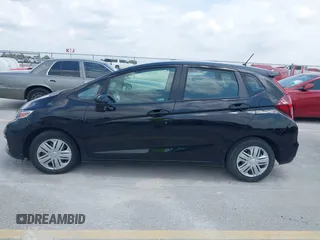2020 Honda Fit LX z VIN 3HGGK5H45LM733449, wystawiony jako IAAI lot #42388666 z przebiegiem 28 064 mil mil oraz . Historia ofert i sprzedaży dostępna na DreamBid. Obrazek 14.