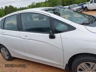 2019 Honda Fit LX z VIN 3HGGK5H4XKM704303, wystawiony jako IAAI lot #42019753 z przebiegiem 137 271 mil mil oraz . Historia ofert i sprzedaży dostępna na DreamBid. Obrazek 13.